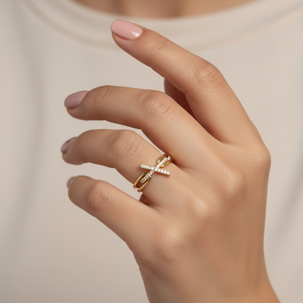 SHE BEAUTY gold-toned anti-tarnish ring featuring a delicate X-shaped design with sparkling AD stones on a finger