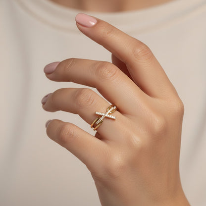 SHE BEAUTY gold-toned anti-tarnish ring featuring a delicate X-shaped design with sparkling AD stones on a finger