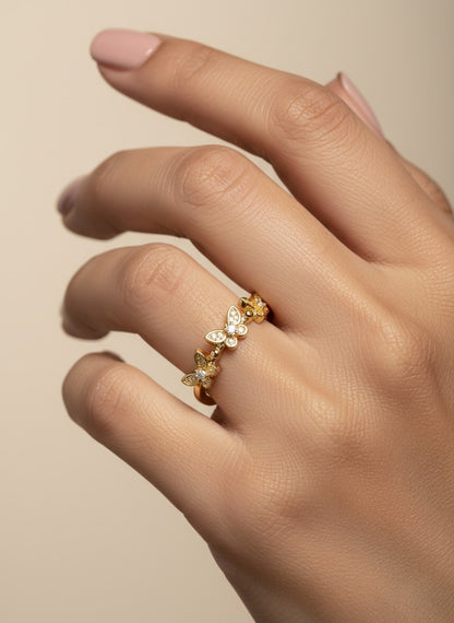 SHE BEAUTY gold-toned anti-tarnish ring featuring delicate butterfly motifs with sparkling AD stones on a hand