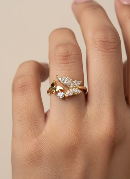 SHE BEAUTY gold-toned anti-tarnish ring featuring a delicate butterfly design with sparkling AD stone accents.