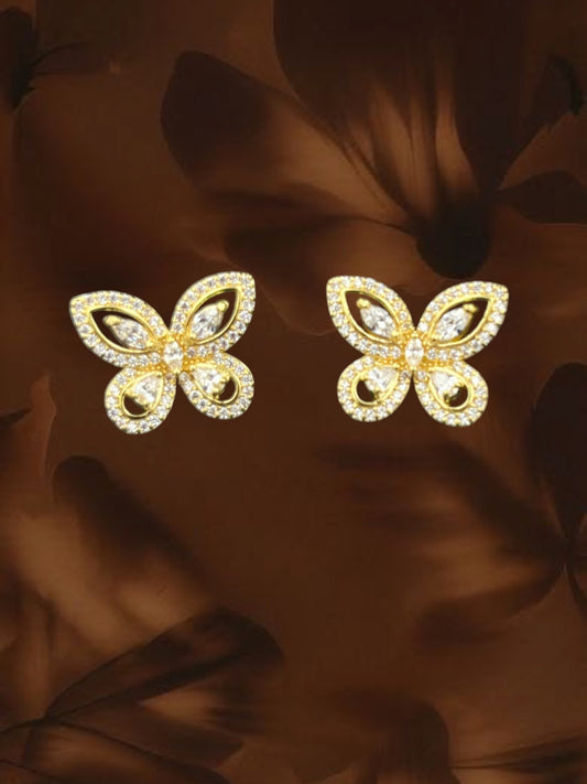 SHE BEAUTY butterfly stud earrings in gold-tone metal with sparkling white cubic zirconia stones for festive wear.