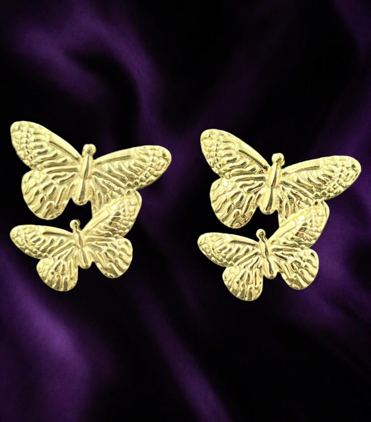SHE BEAUTY gold-toned butterfly stud earrings with anti-tarnish finish for festive and party wear.