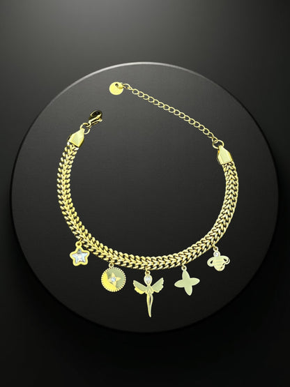 SHE BEAUTY KIYU ZIYU gold-tone chain bracelet featuring dangling charms including a star, fairy, and flower.