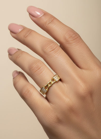SHE BEAUTY gold-toned anti-tarnish ring featuring a central chain link design with sparkling AD stone accents.
