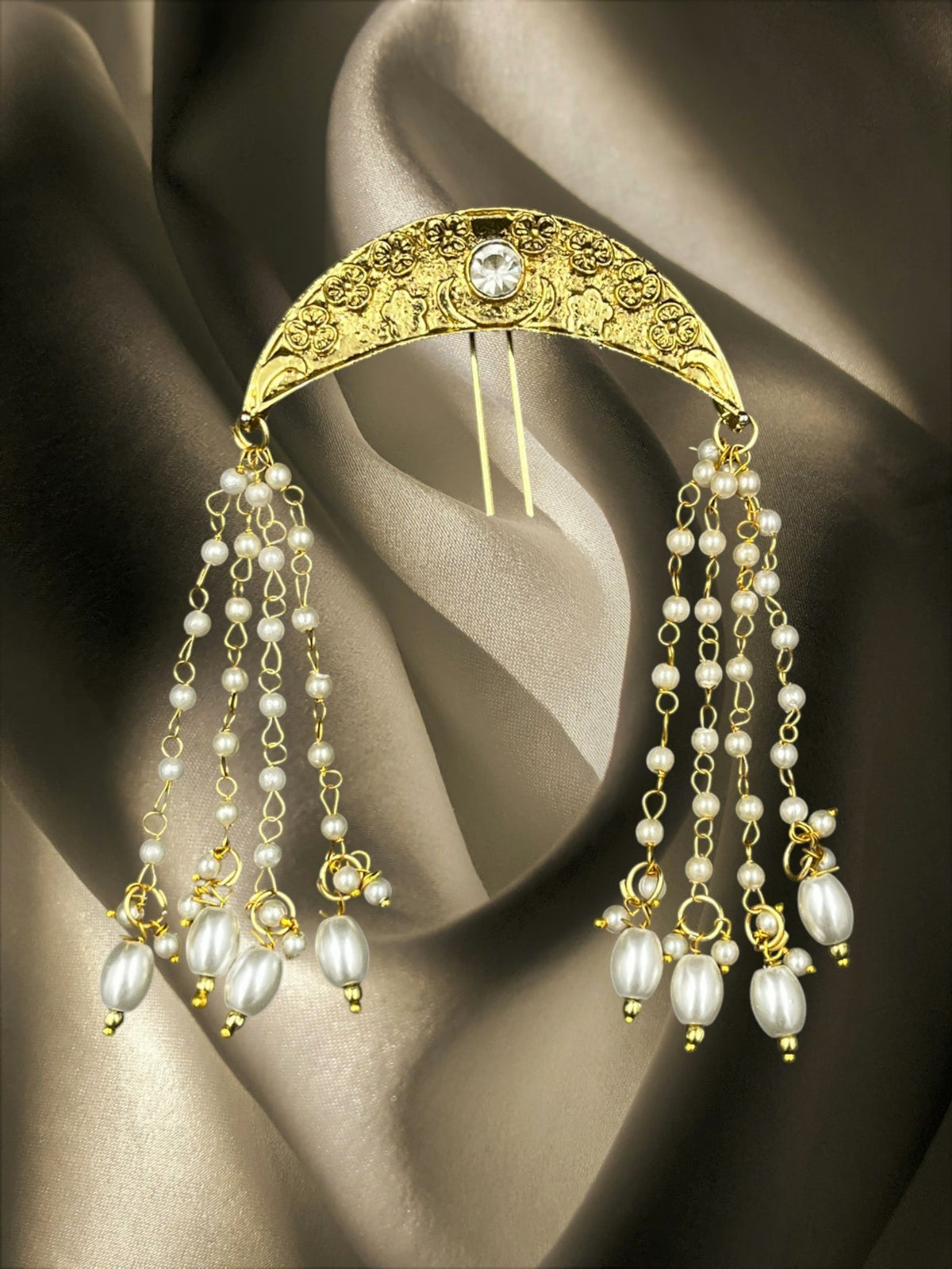 SHE BEAUTY gold-toned crescent moon hair brooch featuring intricate floral engravings and dangling pearl bead chains.