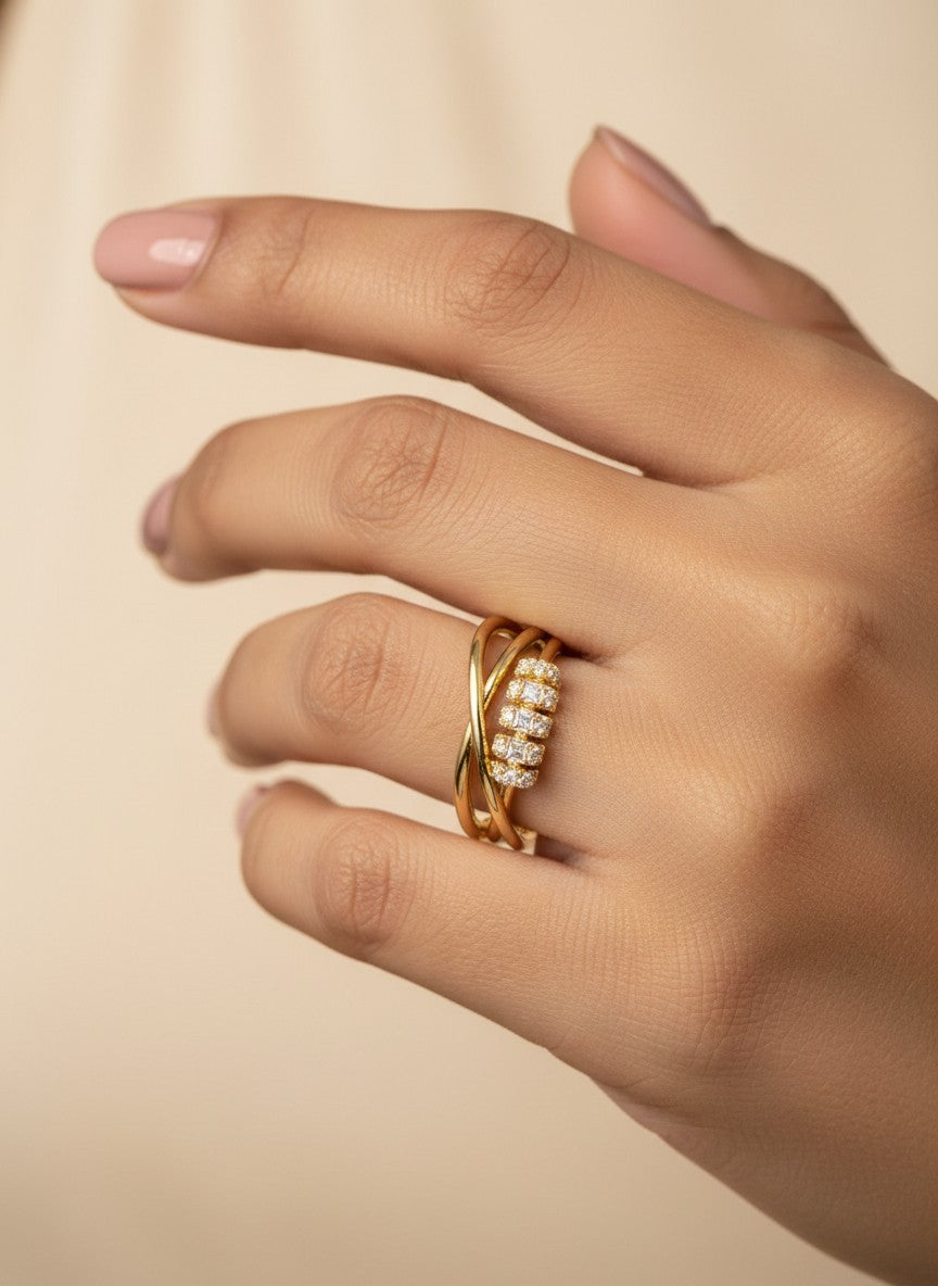 SHE BEAUTY anti-tarnish gold ring featuring a crossover band design with sparkling AD stones on a woman's finger