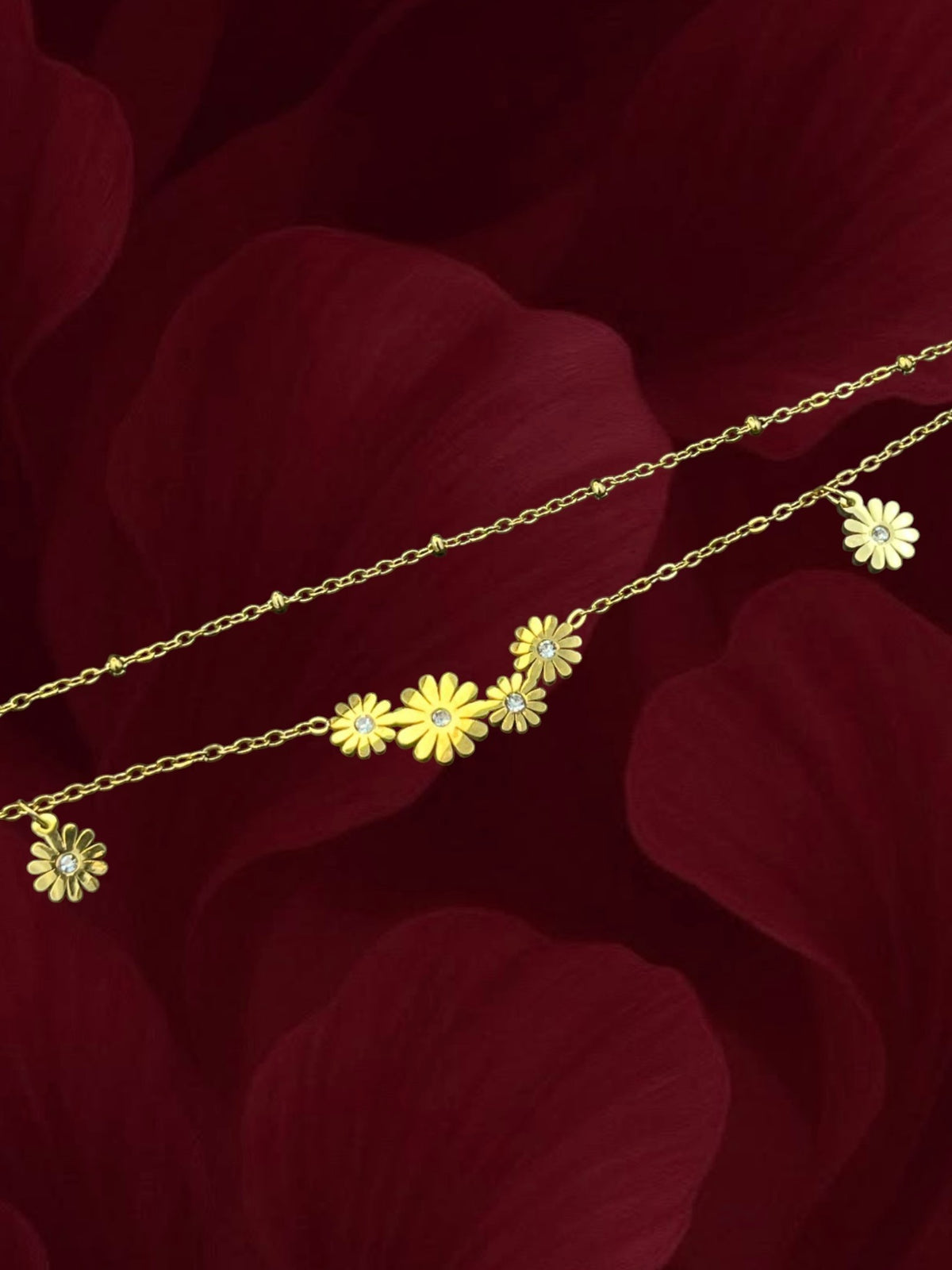 SHE BEAUTY KIYU ZIYU gold-toned layered anklet featuring delicate daisy flower charms with central crystal accents