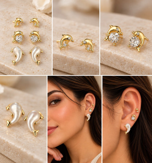SHE BEAUTY gold-toned dolphin stud earrings with zirconia crystals and pearl finish, worn by a model for party wear.