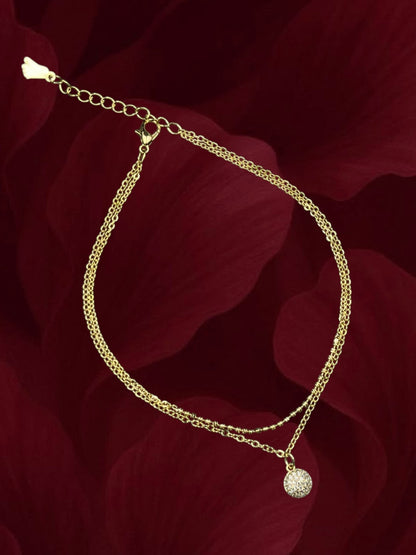 SHE BEAUTY gold-toned anti-tarnish double-chain anklet for girls featuring a sparkling crystal-encrusted charm.