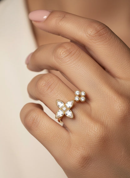 SHE BEAUTY anti-tarnish gold ring featuring a floral design with sparkling AD stones worn on a woman's finger