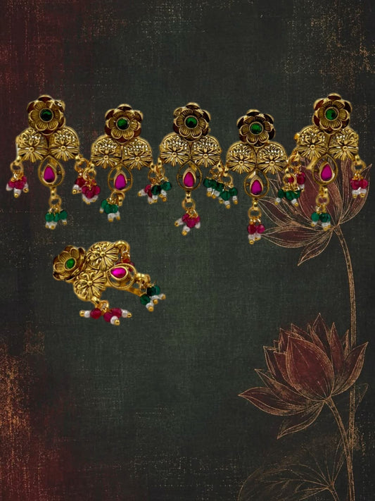 SHE BEAUTY designer flower charms set featuring gold-toned metal with pink and green stone accents for festive wear.