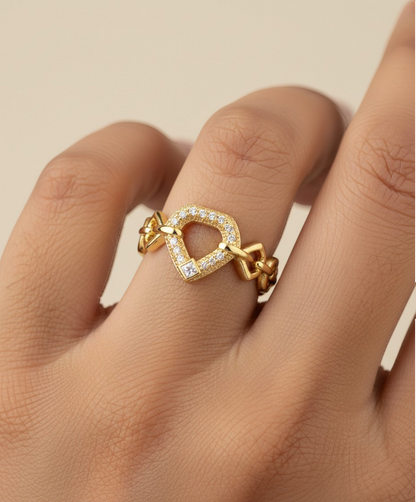 SHE BEAUTY gold-toned anti-tarnish ring featuring a geometric heart-shaped center with sparkling AD stone accents.