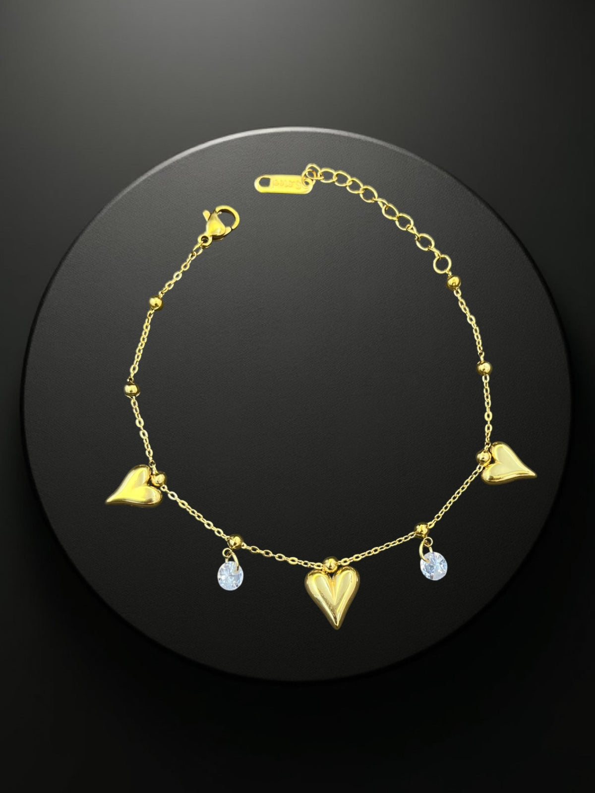 SHE BEAUTY KIYU ZIYU gold-tone chain bracelet featuring heart charms and sparkling crystal accents for festive wear.