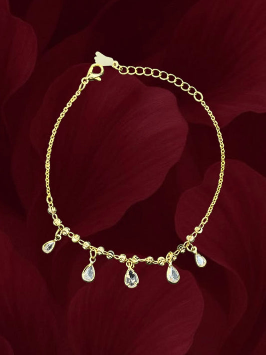 SHE BEAUTY gold-tone anti-tarnish kids anklet featuring delicate chain links and dangling teardrop crystal charms.