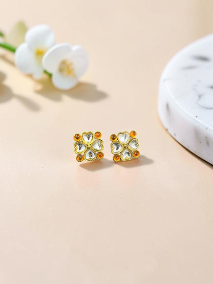 SHE BEAUTY gold-toned kundan tops featuring a four-leaf clover design with clear and amber stones for ethnic wear.