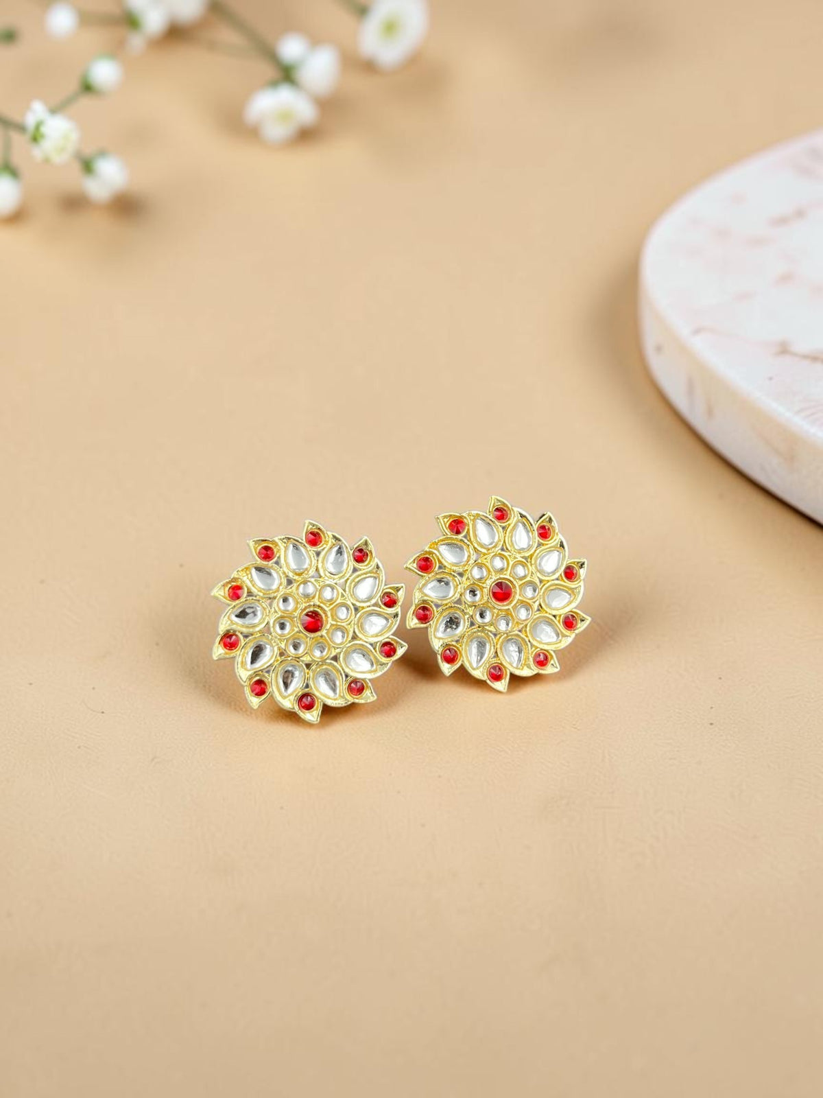 SHE BEAUTY gold-toned kundan tops featuring a floral design with red and white stones for ethnic and festive wear.