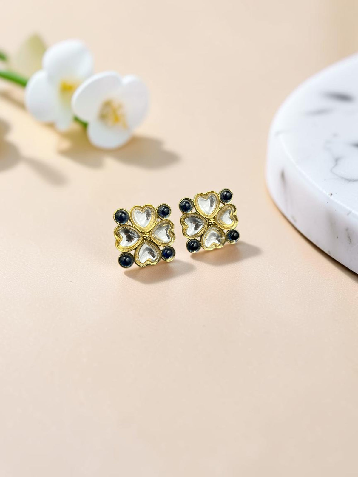 SHE BEAUTY gold-toned kundan tops with heart-shaped clear stones and dark blue accents for ethnic and festive wear.