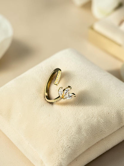 SHE BEAUTY gold-toned anti-tarnish ring featuring a delicate leaf-shaped design with sparkling white AD stones.