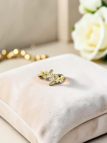 SHE BEAUTY gold-tone anti-tarnish ring featuring a delicate leaf design with sparkling AD stones on a velvet cushion