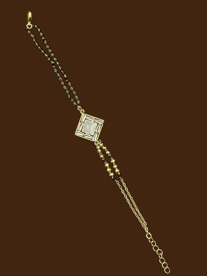 SHE BEAUTY anti-tarnish gold-plated mangalsutra bracelet with a square AD stone pendant and black beaded chain