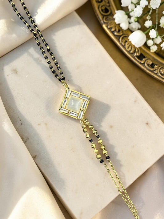 SHE BEAUTY anti-tarnish gold-toned mangalsutra bracelet with a square stone pendant and black beaded chain