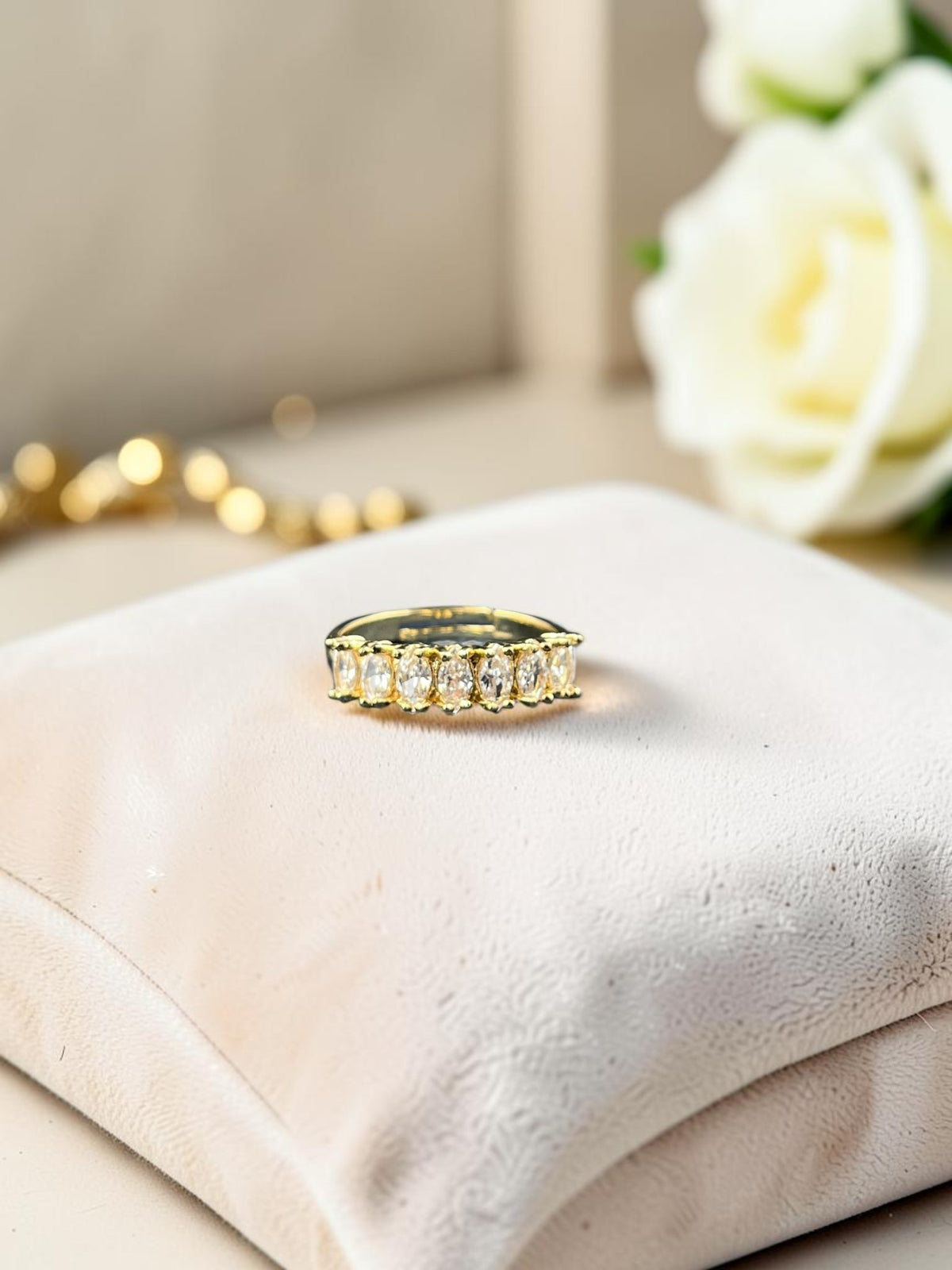 SHE BEAUTY gold-toned anti-tarnish ring featuring a row of sparkling marquise-cut American Diamond stones.