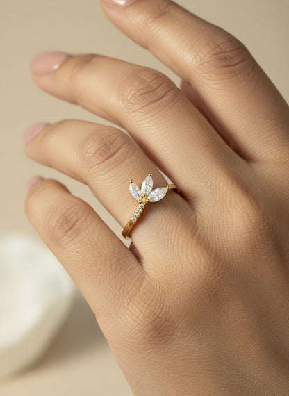 SHE BEAUTY anti-tarnish gold ring featuring three marquise-cut white stones on a delicate band worn on a finger