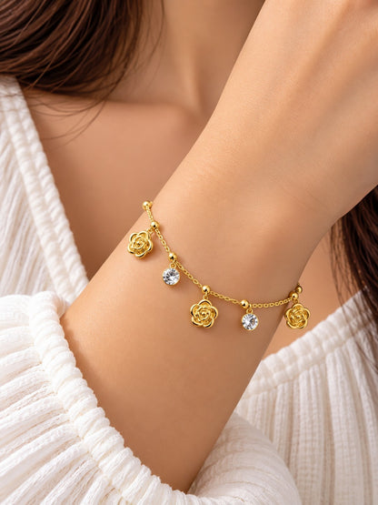 SHE BEAUTY KIYU ZIYU gold chain bracelet featuring delicate rose charms and sparkling crystal accents on a wrist.