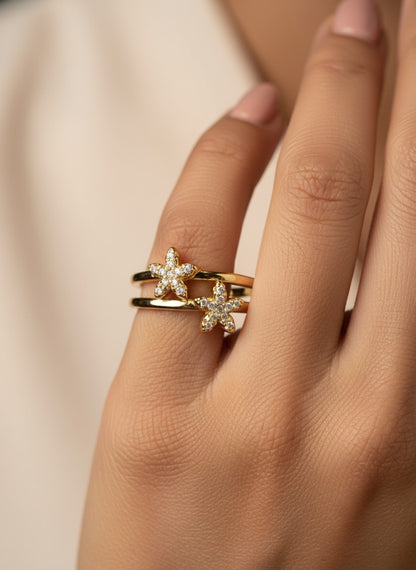 SHE BEAUTY gold-toned anti-tarnish ring featuring two delicate star-shaped motifs with sparkling AD stones