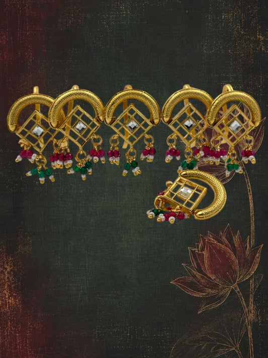 SHE BEAUTY set of 6 gold-toned stone studded charms with dangling red, green, and white beads for festive jewelry.