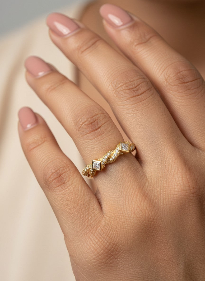 SHE BEAUTY anti-tarnish gold ring with twisted band and square-cut AD stones worn on a finger