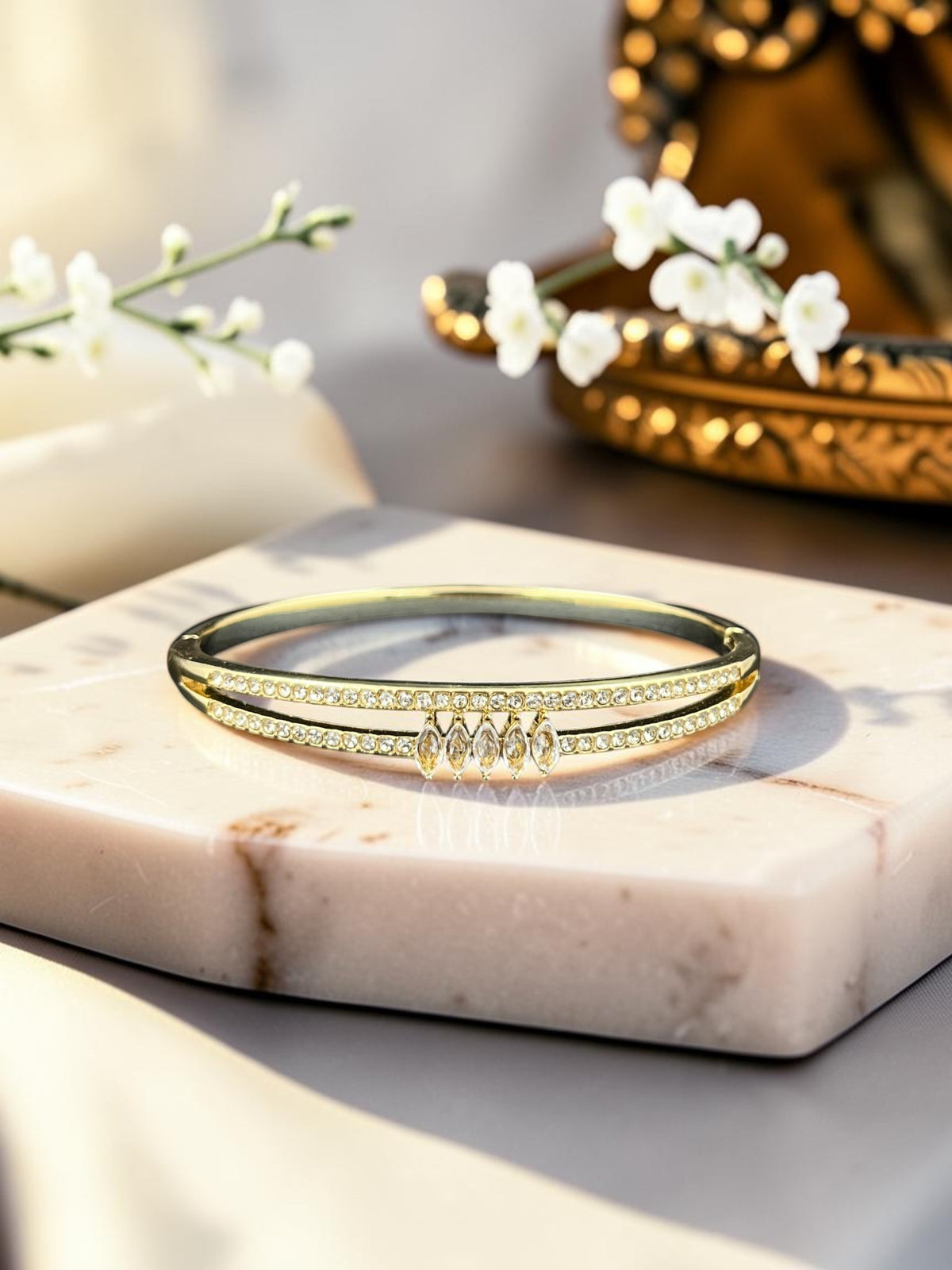 SHE BEAUTY anti-tarnish gold bracelet featuring a double band design with sparkling zirconia stones and marquise gems