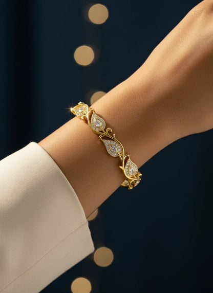 SHE BEAUTY anti-tarnish gold bracelet featuring delicate leaf-shaped zirconia stones on a woman's wrist
