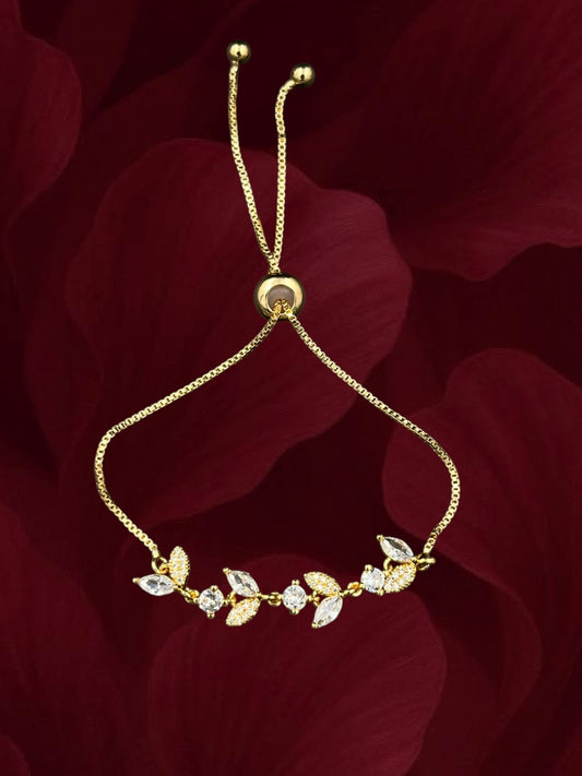 SHE BEAUTY gold-toned zirconia leaf bracelet with adjustable chain, perfect for festive and party wear.