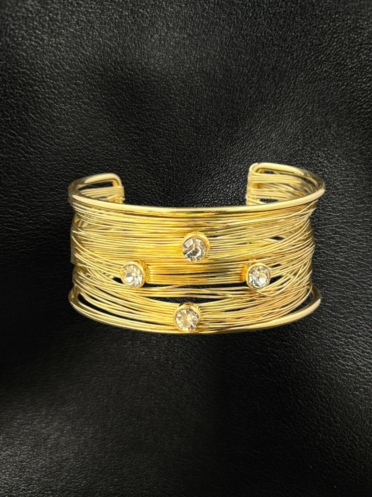 SHE BEAUTY multilayer golden cuff bracelet featuring delicate wire strands and sparkling AD stones on black leather