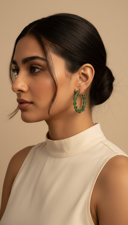 SHE BEAUTY Girlish Crystal Bali hoop earrings featuring a twisted green beaded design worn by a woman