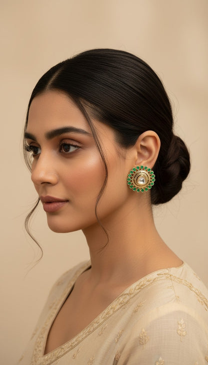 SHE BEAUTY round kundan tops with green stone accents worn by a model in a traditional Indian style