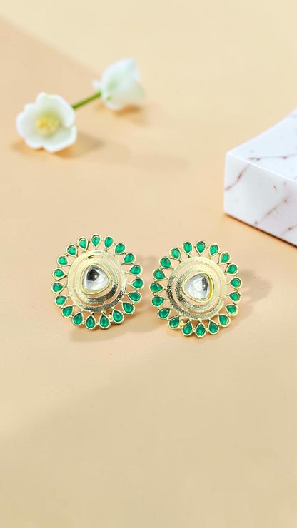 SHE BEAUTY round kundan tops with a central stone surrounded by green teardrop accents in a gold-tone finish.