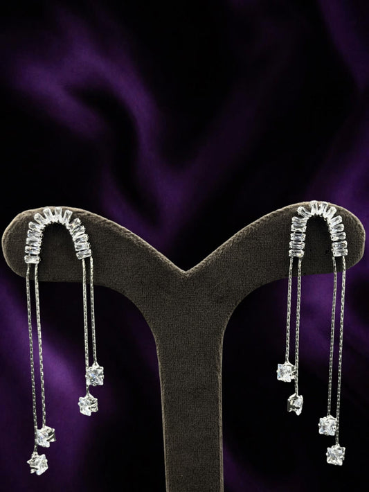 SHE BEAUTY ICY DROPS earrings featuring silver-tone chains with sparkling baguette and square-cut crystal accents.