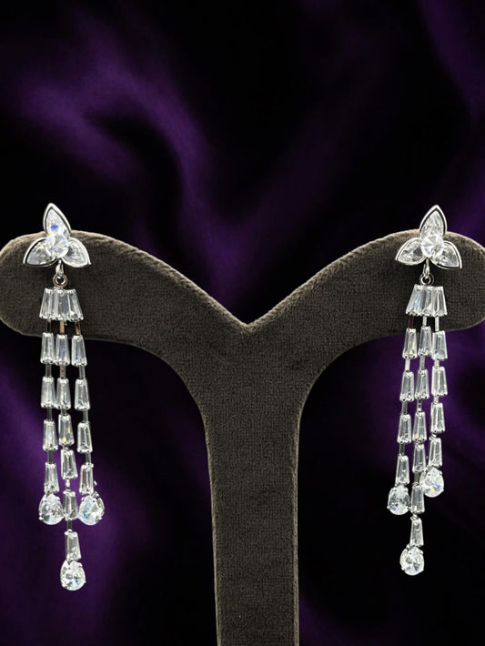 SHE BEAUTY ICY VINES silver-toned drop earrings featuring sparkling baguette and pear-cut crystals for festive wear.