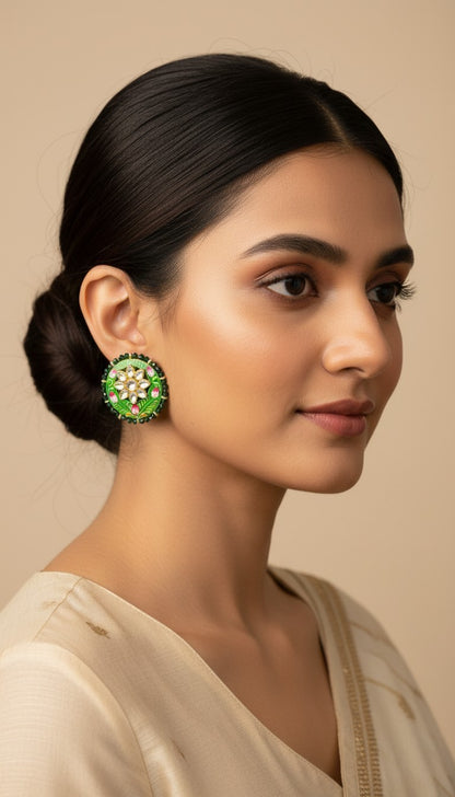 SHE BEAUTY Jaipuri Meena tops featuring green enamel, floral motifs, and white stones worn by a woman in a bun.