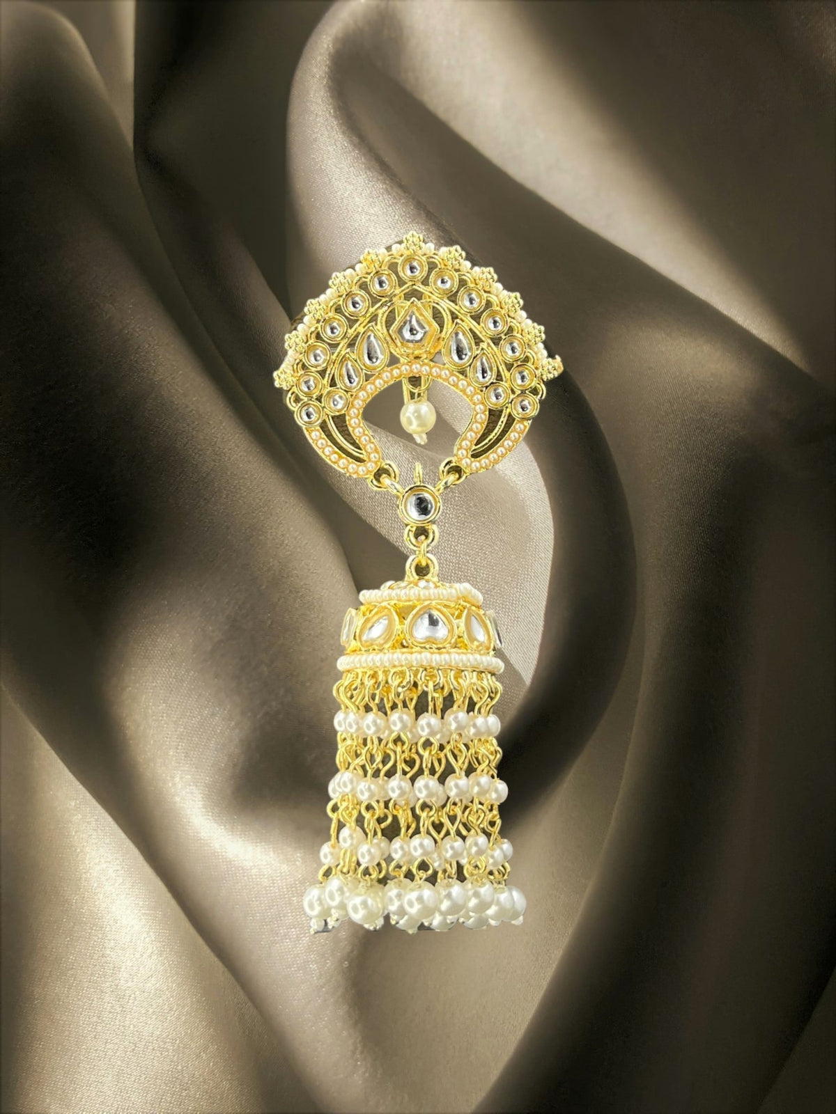 SHE BEAUTY Kashmiri Jhumar hair brooch featuring gold-tone Kundan stones and delicate hanging pearl tassels.