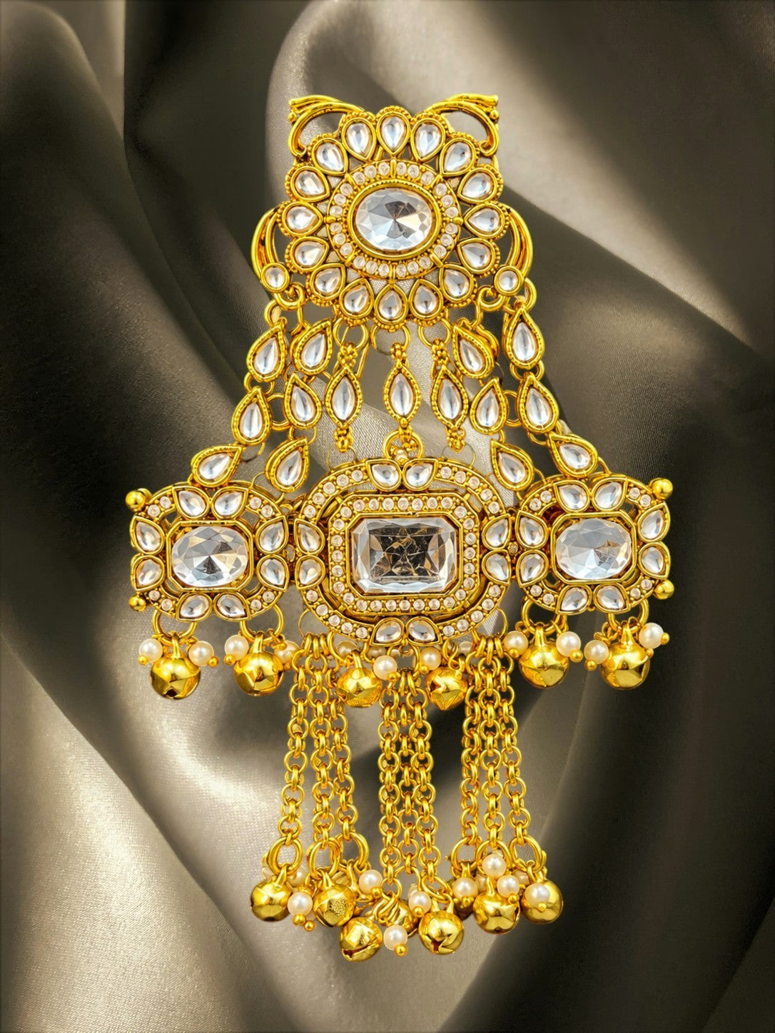 SHE BEAUTY Kashmiri AD Kundan Juda hair brooch in gold tone with sparkling stones, pearl accents, and hanging ghungroos.
