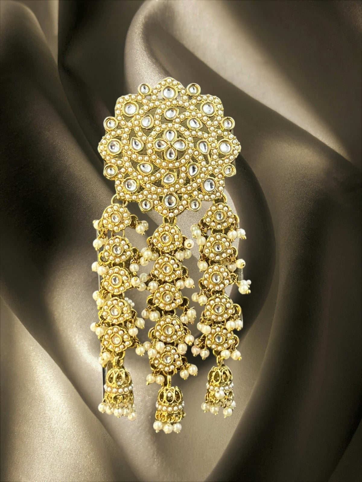 SHE BEAUTY Kashmiri Polki floral Kundan juda hair brooch with intricate gold-tone metalwork and pearl accents.