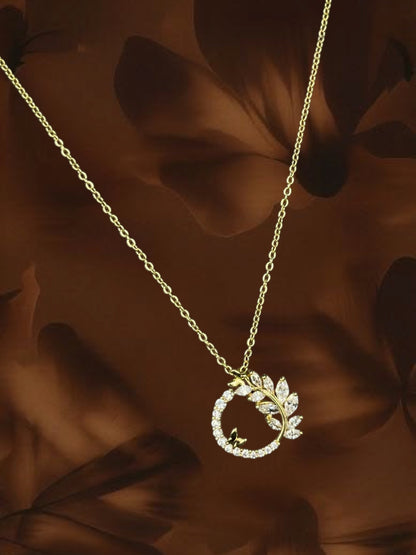 SHE BEAUTY Korean halo pendant necklace featuring a gold-tone chain with a leaf and butterfly crystal charm