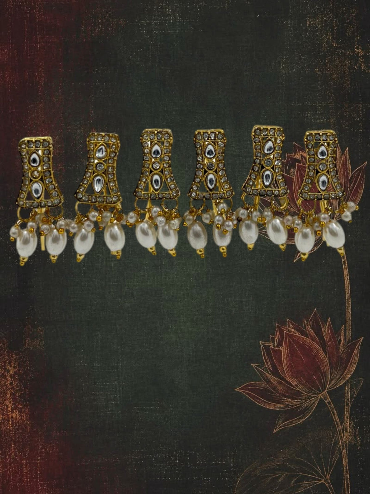 SHE BEAUTY set of 6 gold-toned kundan charms featuring white pearl beads and clear stone accents for festive wear.