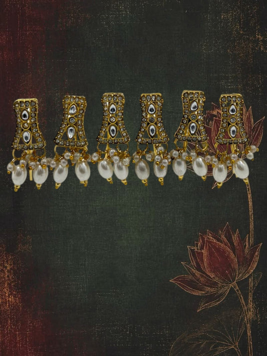 SHE BEAUTY set of 6 gold-toned kundan charms featuring white pearl beads and clear stone accents for festive wear.