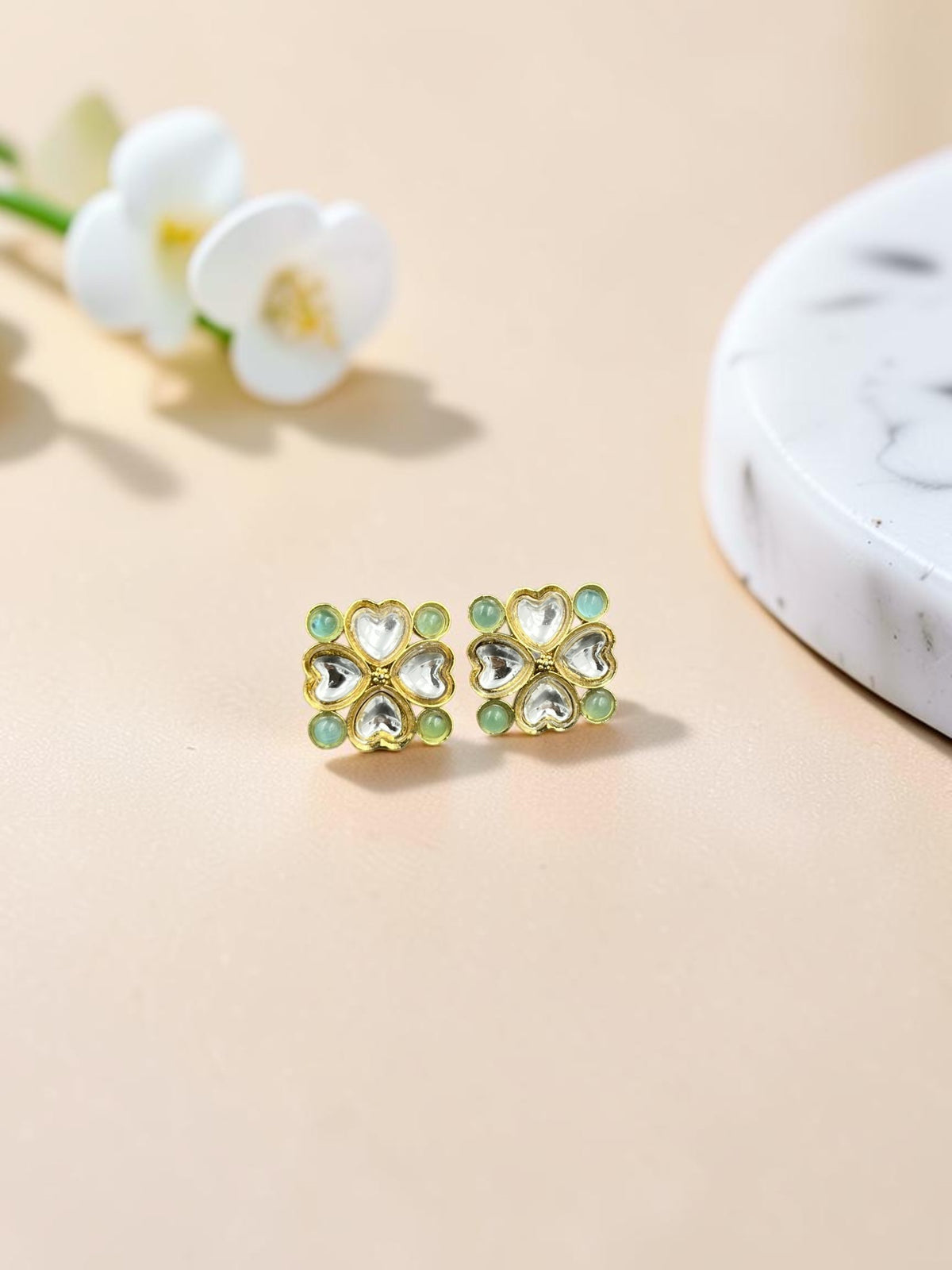 SHE BEAUTY gold-toned kundan tops featuring a floral heart design with light green accents for ethnic wear