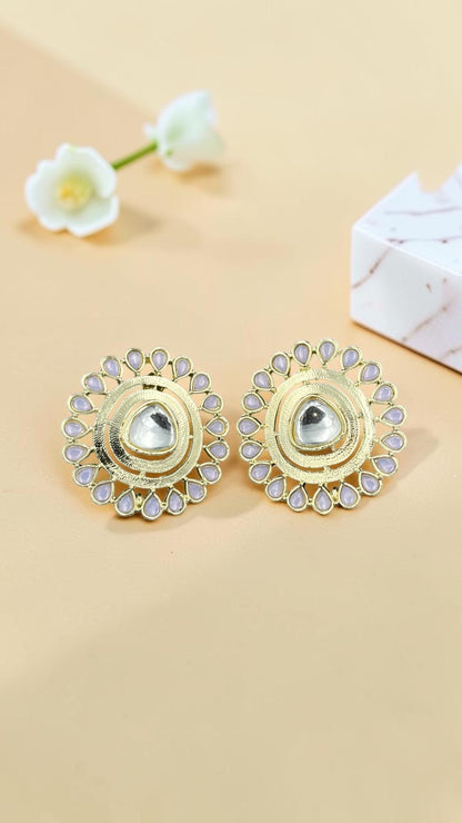 SHE BEAUTY gold-toned kundan stud earrings with a central stone and delicate lavender petal-shaped accents.