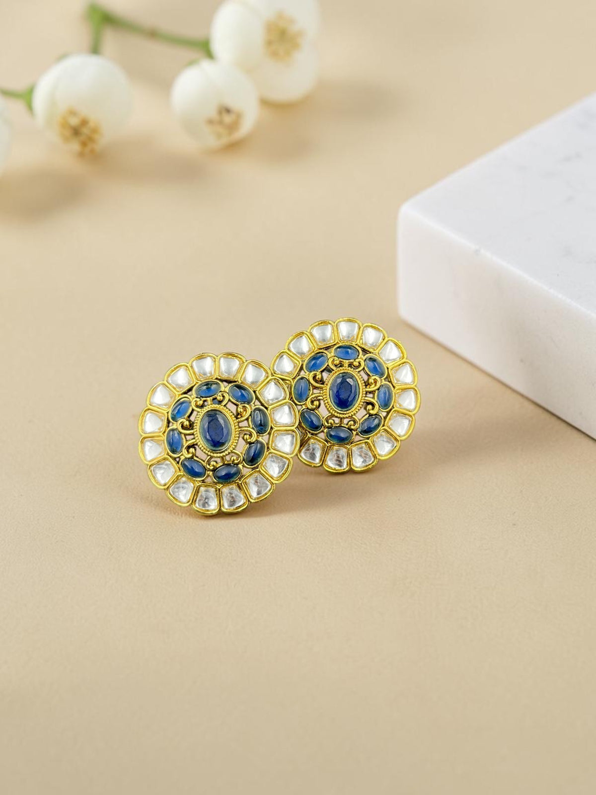 SHE BEAUTY kundan tops featuring blue oval stones and white accents in a gold-toned traditional Indian design.